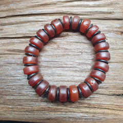 Amazing Antique Carnelian Red Agate 12mm Beads Bracelet . Crafted with meticulous attention to detail, this stunning bracelet exudes vintage charm and timeless elegance. Each 12mm red agate bead showcases its natural beauty, creating a mesmerizing display of rich hues and intricate patterns.
