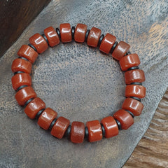 Antique Tire Shape Carnelian Agate 10mm Beads Bracelet, crafted with meticulous attention to detail. Each bead showcases the rich, natural hues of carnelian agate, renowned for its captivating beauty and grounding energy. With its unique tire shape design, this bracelet exudes a timeless charm that effortlessly complements any outfit. Elevate your accessory collection with this statement piece, perfect for adding a touch of sophistication to any ensemble.