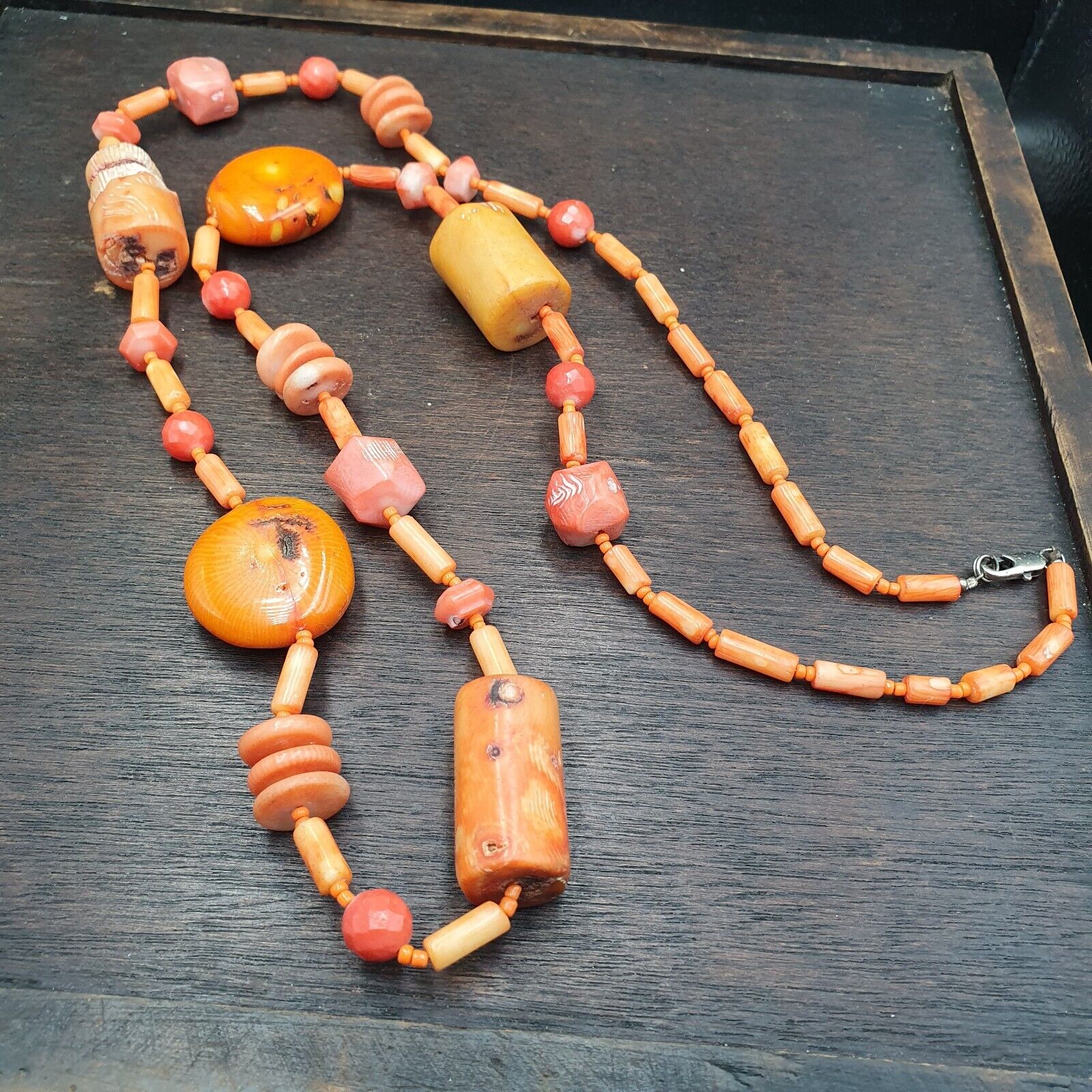 Long Coral Beads Vintage Pink and Orange Coral Beads Necklace. Handcrafted with meticulous care, this statement piece seamlessly blends vintage charm with contemporary allure. Each coral bead exudes natural beauty, showcasing unique patterns and hues, adding a touch of sophistication to any ensemble. Whether paired with a casual outfit or a formal attire, this exquisite necklace elevates your style effortlessly. 