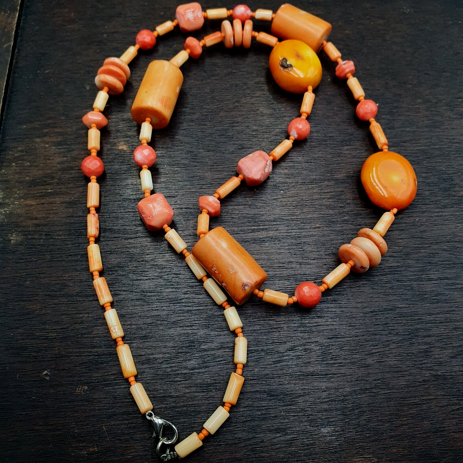 Coral Beads Vintage Pink and Orange Coral Beads Necklace. Handcrafted with meticulous care, this statement piece seamlessly blends vintage charm with contemporary allure. Each coral bead exudes natural beauty, showcasing unique patterns and hues, adding a touch of sophistication to any ensemble. 