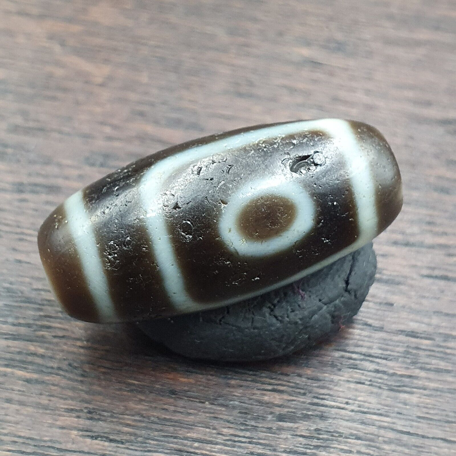 "Two antique Tibetan Agate Dzi beads, featuring a rare 'slide eyes' design, highly prized as an amulet (OTB8-2). These high-quality beads are believed to bring good fortune, protection, and spiritual growth to the wearer. Originating from Tibet, they showcase exceptional craftsmanship and cultural heritage, making them a valuable addition to any collection."